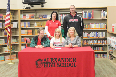 Alexander High School's Jonnalyn Shimko poses with her parents and coaches after signing to play volleyball at Rio